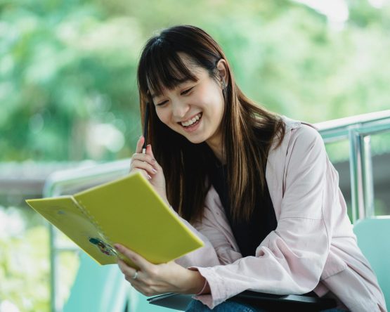 Happy adolescent confidently studying